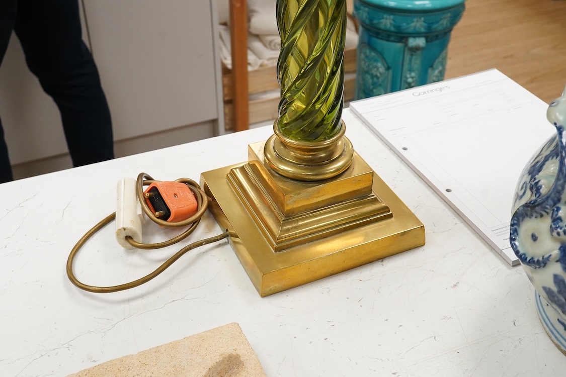 A 19th century gilt and brass green glass corinthian columned oil lamp by Messenger, 68cm high